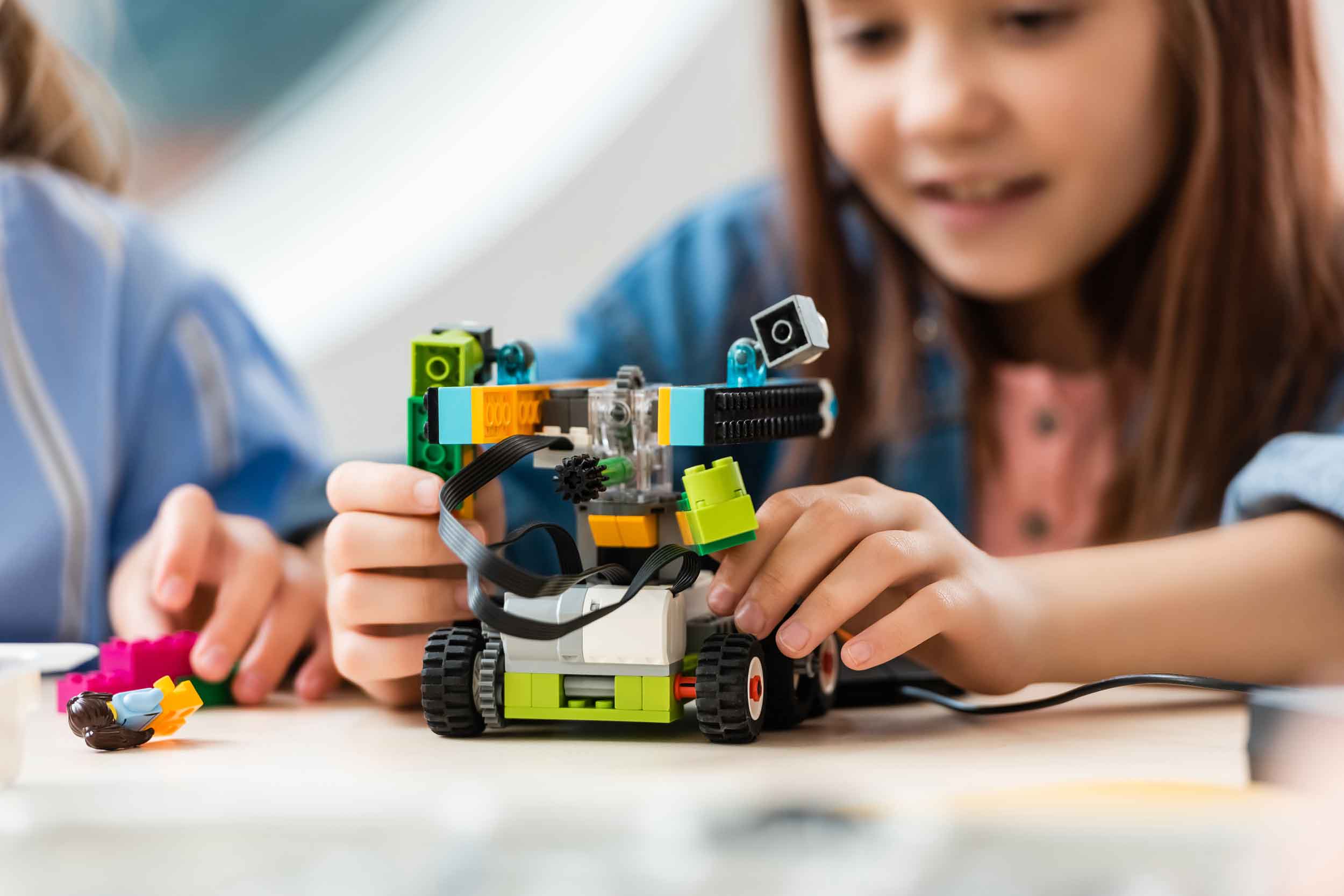Young girl with LEGO robot