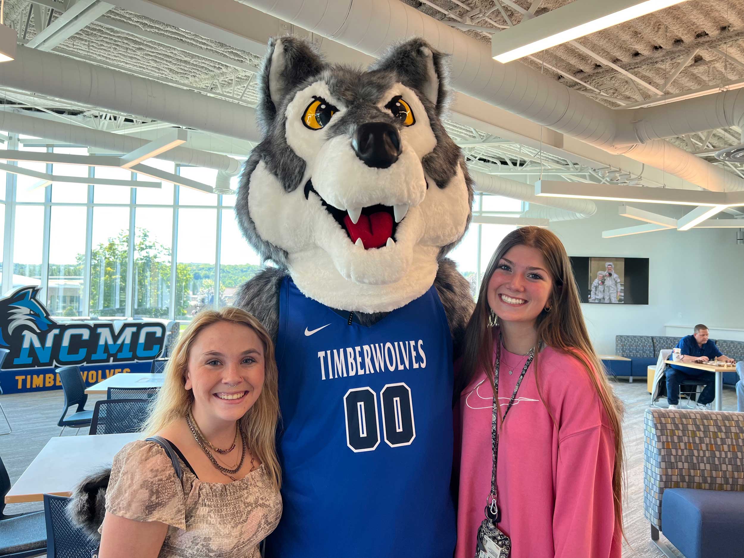 Students standing with the Timberwolf
